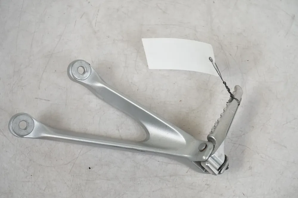 Držák stupačky Honda