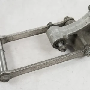 Spojovací mechanismus tlumiče Kawasaki