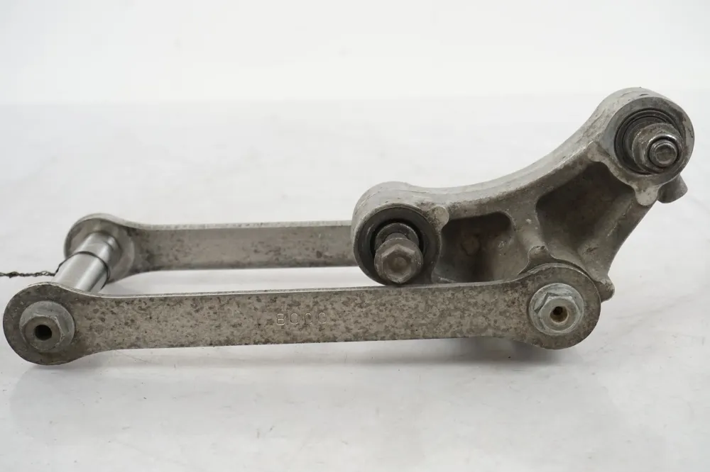 Spojovací mechanismus tlumiče Kawasaki